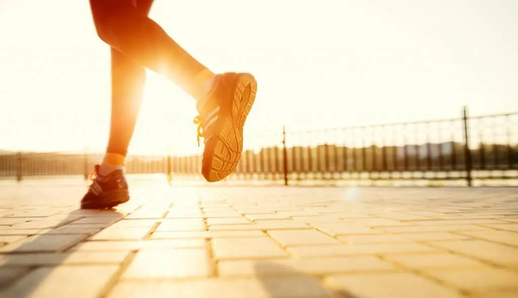 Person running outdoors at sunset