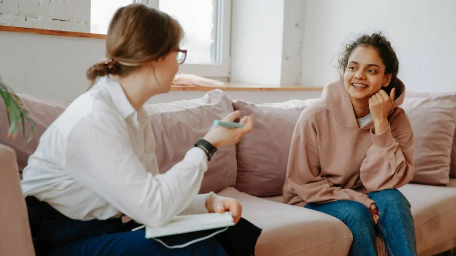 Woman speaking with a healthcare professional during a fertility consultation