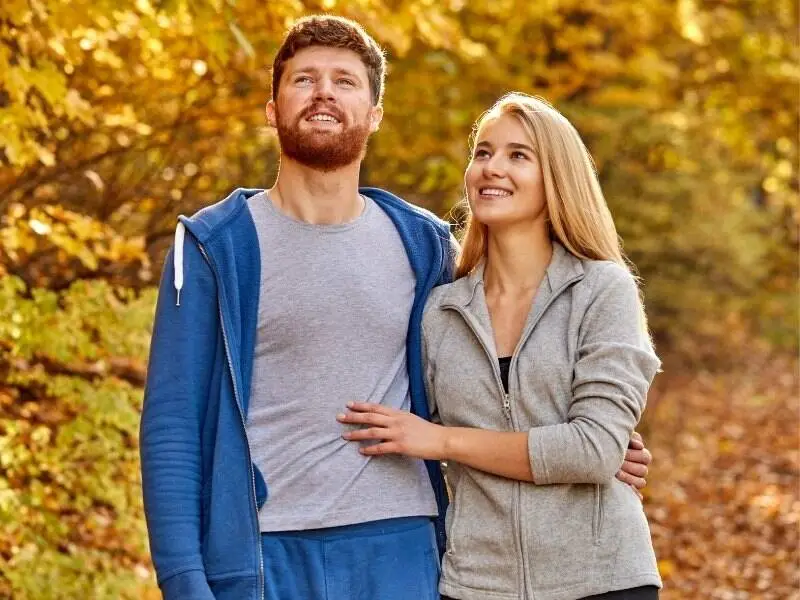 Couple standing together outdoors while trying to conceive