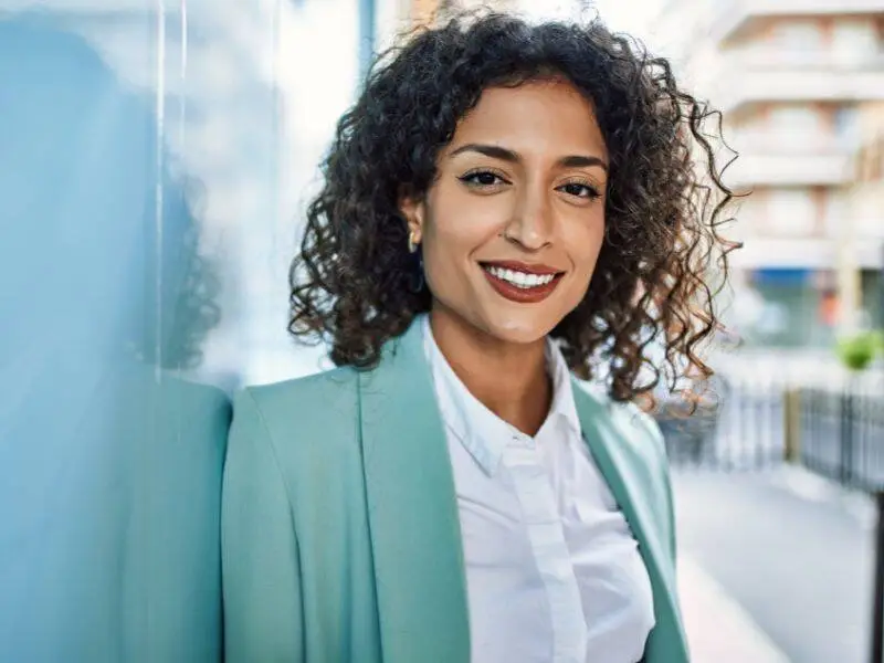 Woman standing outdoors representing estrogen and IVF treatment