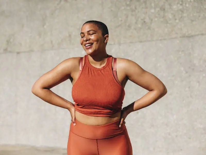 Woman standing outdoors in athletic clothing