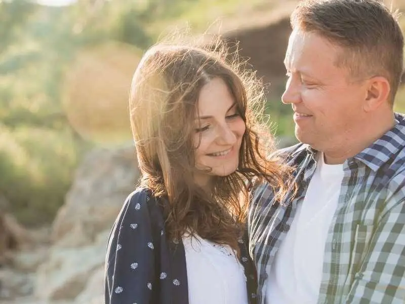 Couple outdoors considering fertility clinic options